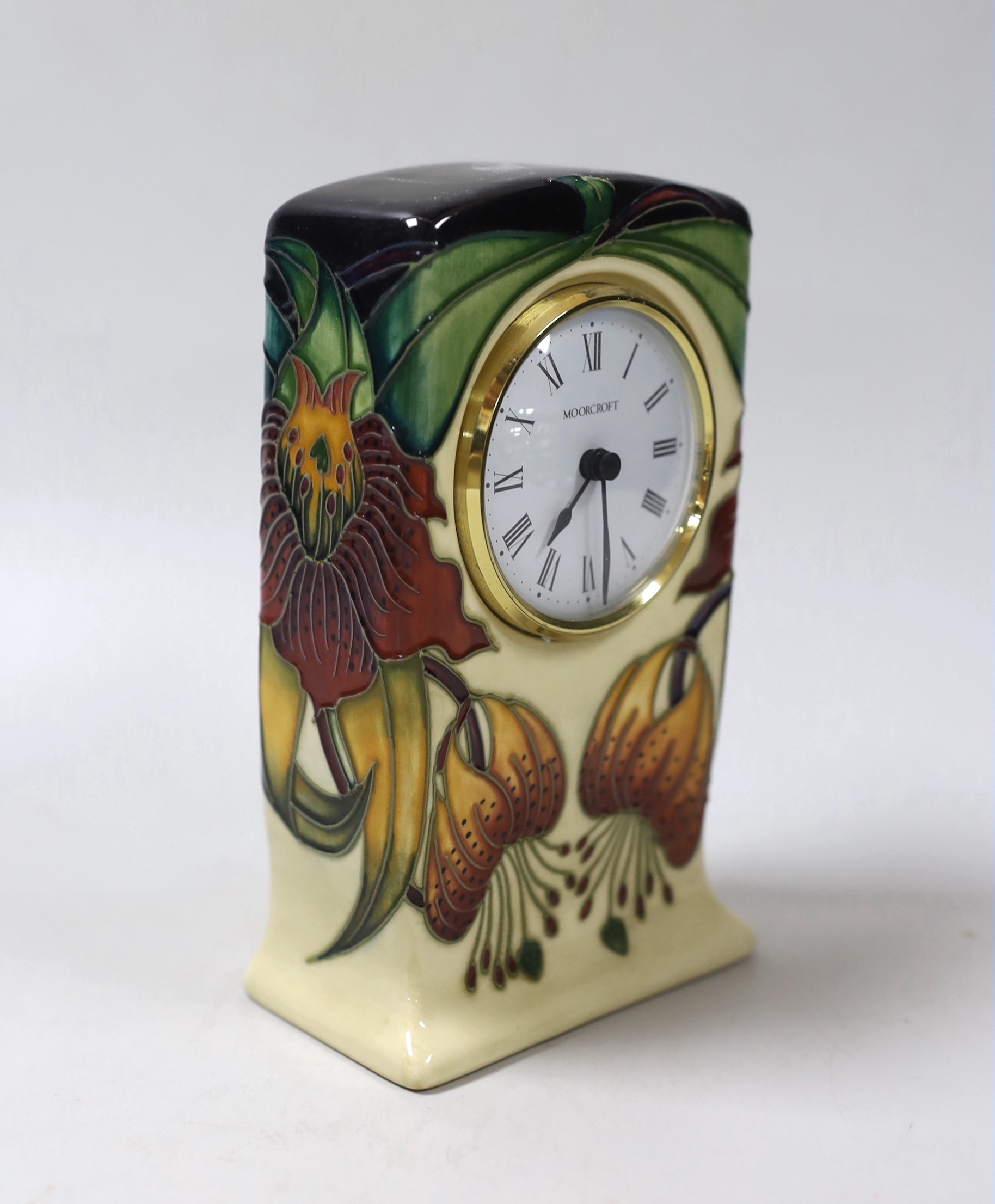 A boxed Moorcroft mantel timepiece, 16cm high